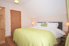 Twin bedroom set up as a super-king bed.